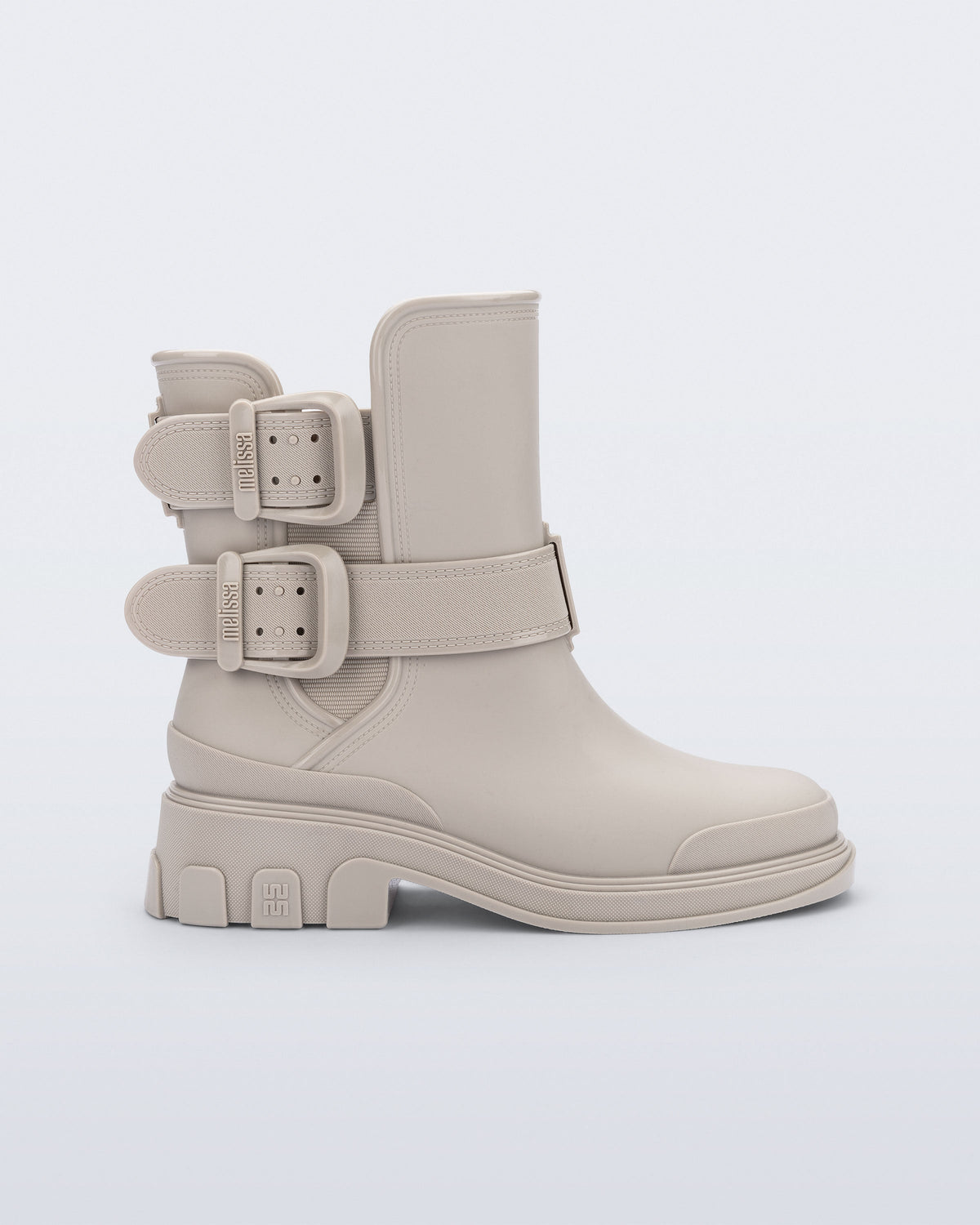 Side view of a beige Bang Boot with two side buckles
