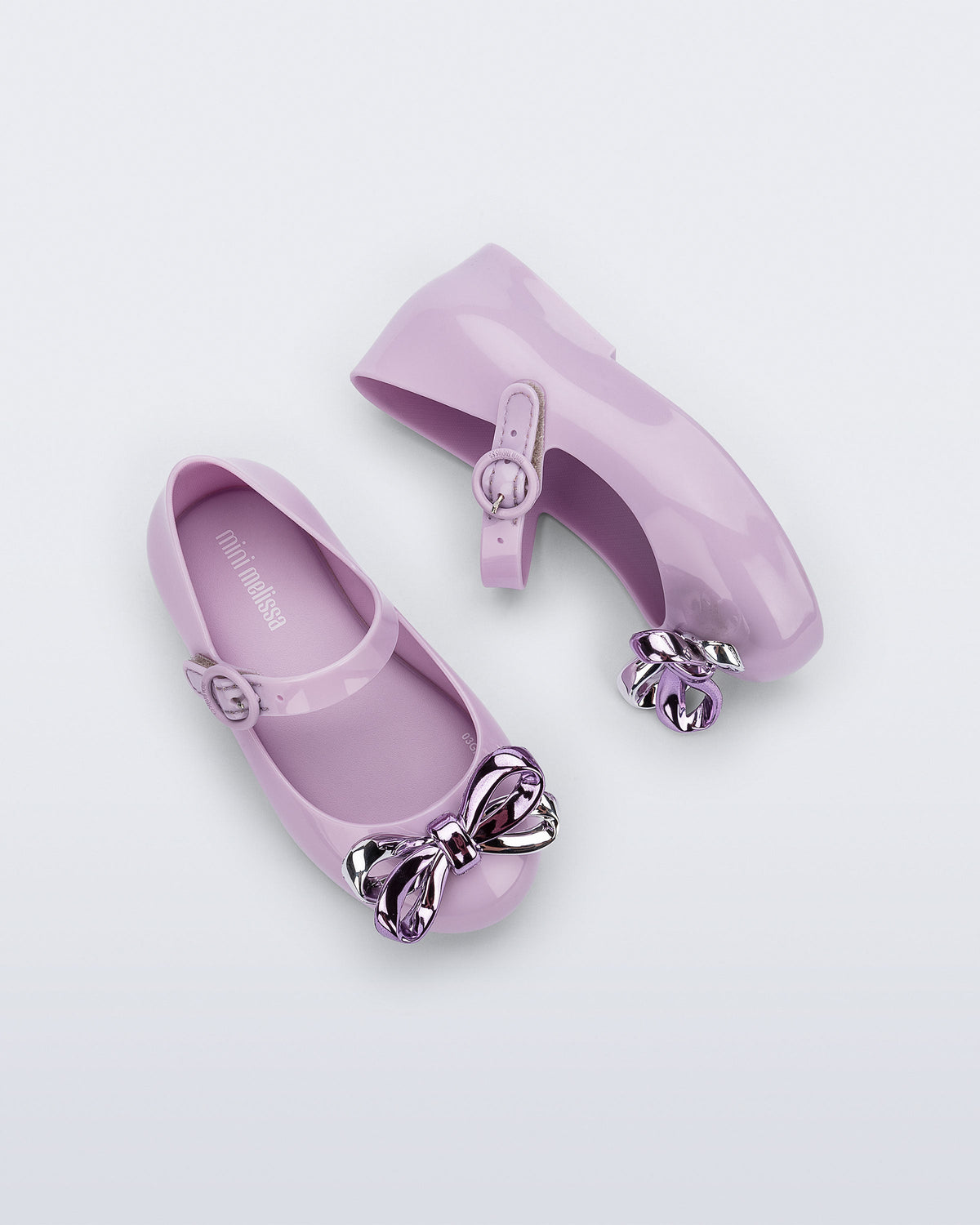 Top and side view of a pair of lilac Sweet Love Glam baby ballerinas with bow