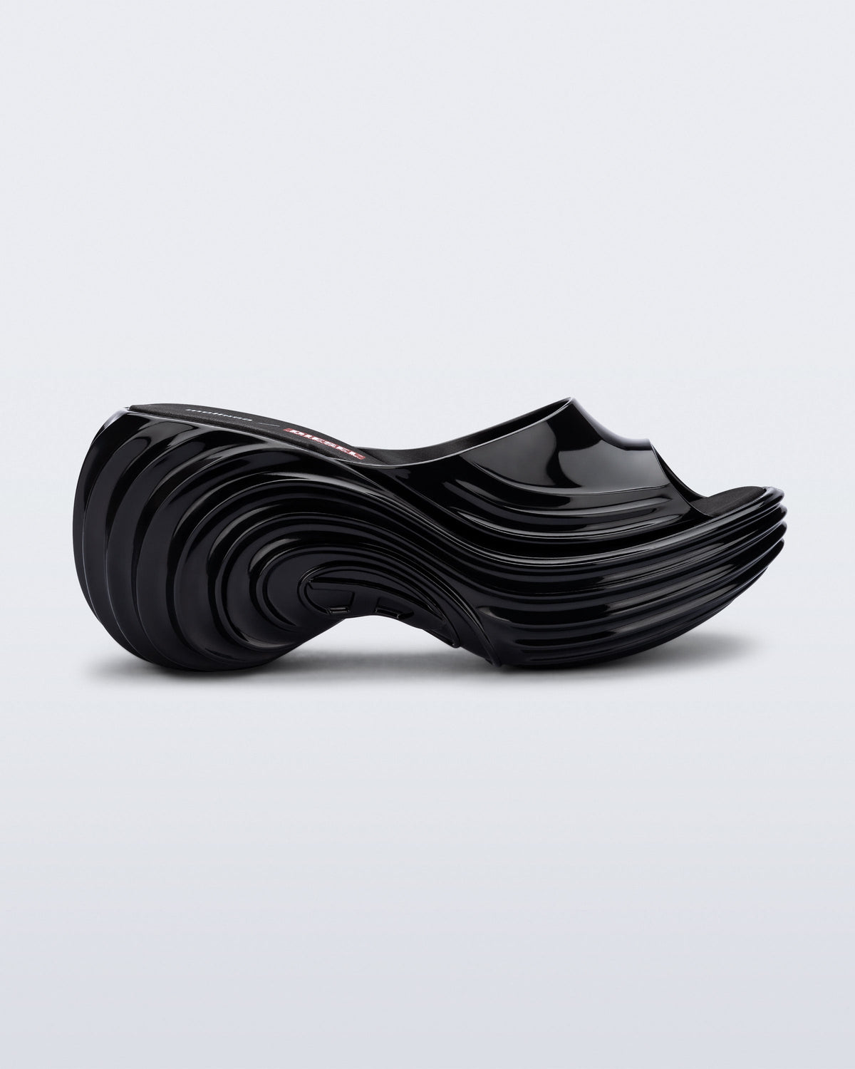 Side view of a black Platforms + Diesel slides