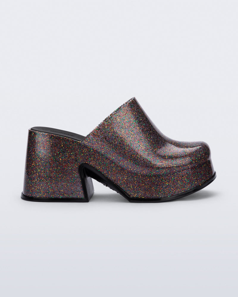 Side view of a mixed glitter Mia mule with black sole