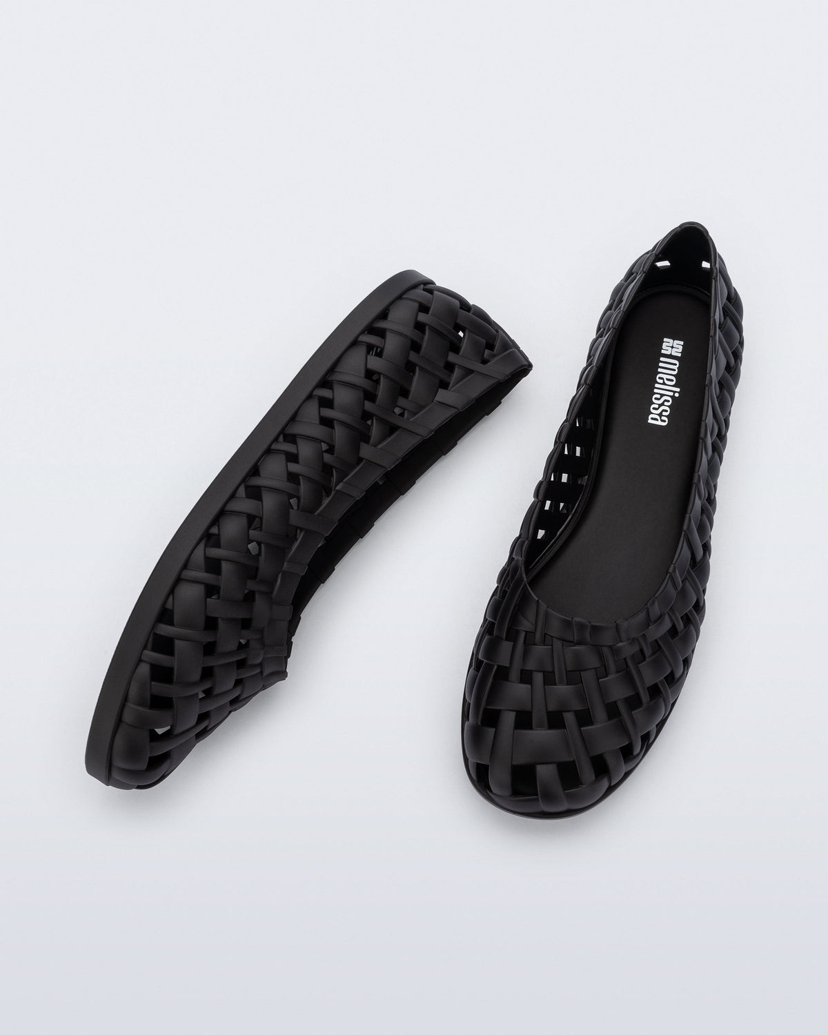 Top and side view of a pair of black Possession Ballerina flats