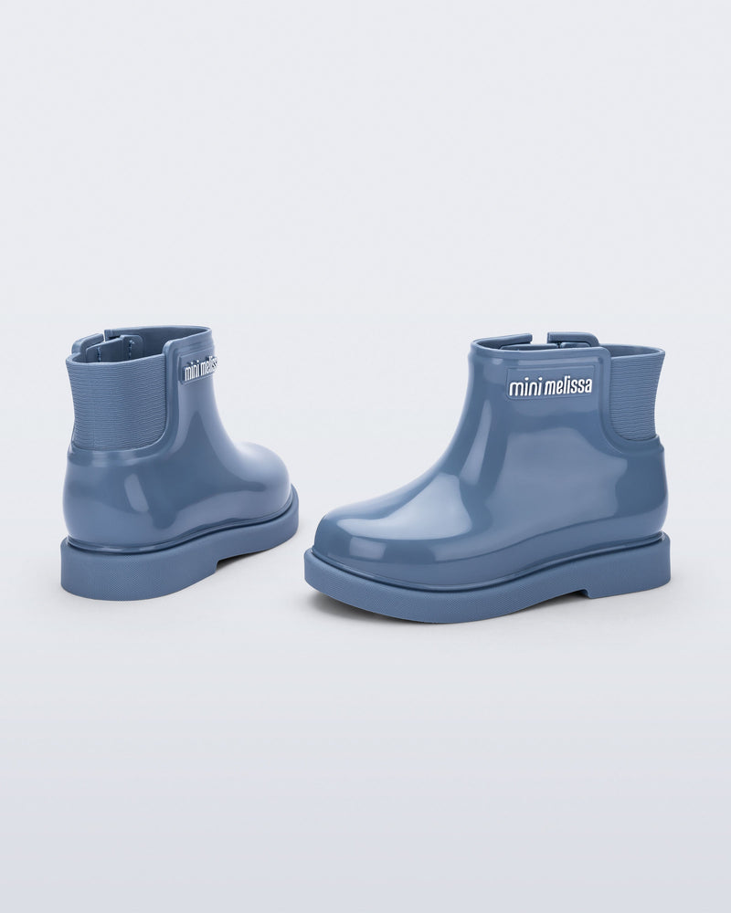 Back and side view of a pair of blue Chelsea II baby boots