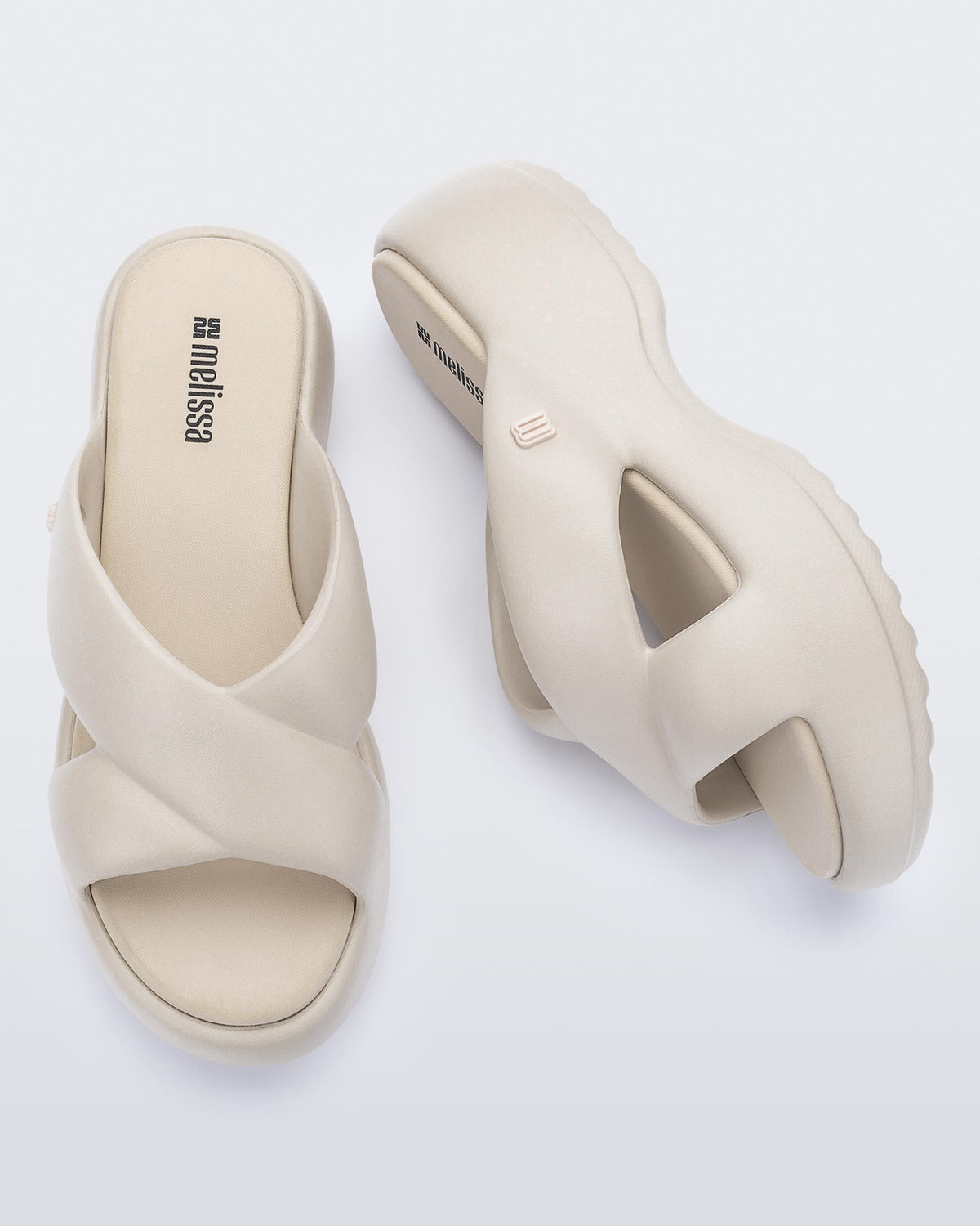 Side and top view of a pair of beige Free Rise platform slide