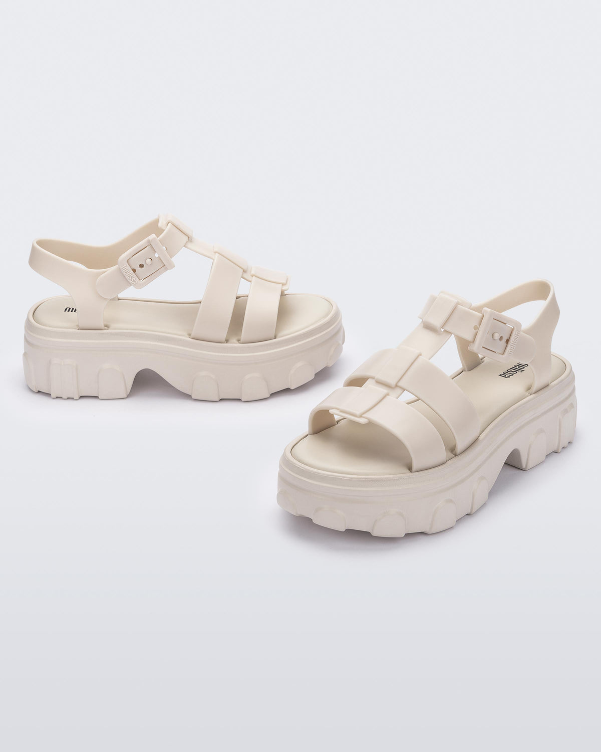 Side and front view of a pair of beige Ella women's platform sandals