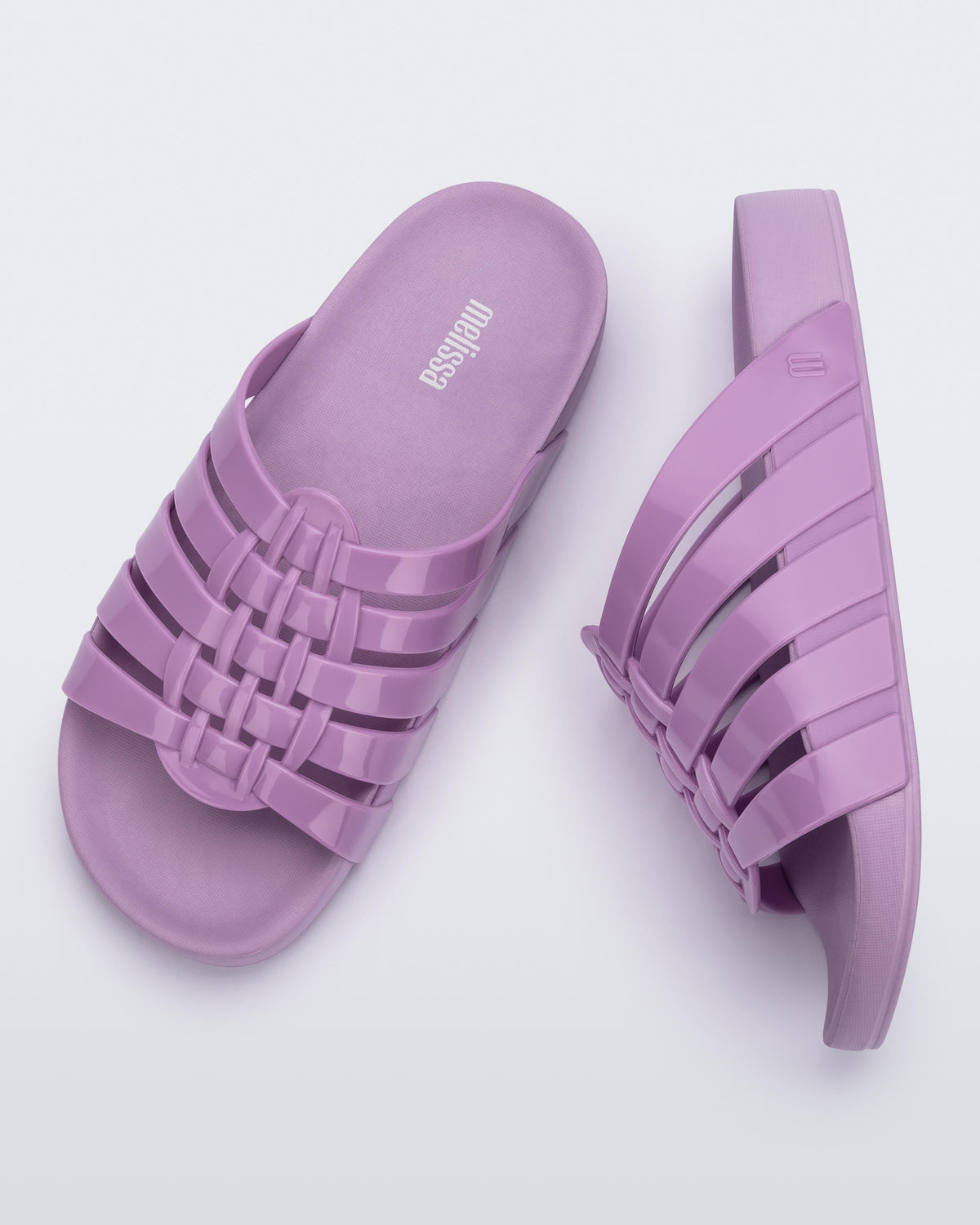 Top and side view of a pair of lilac Possession Slide