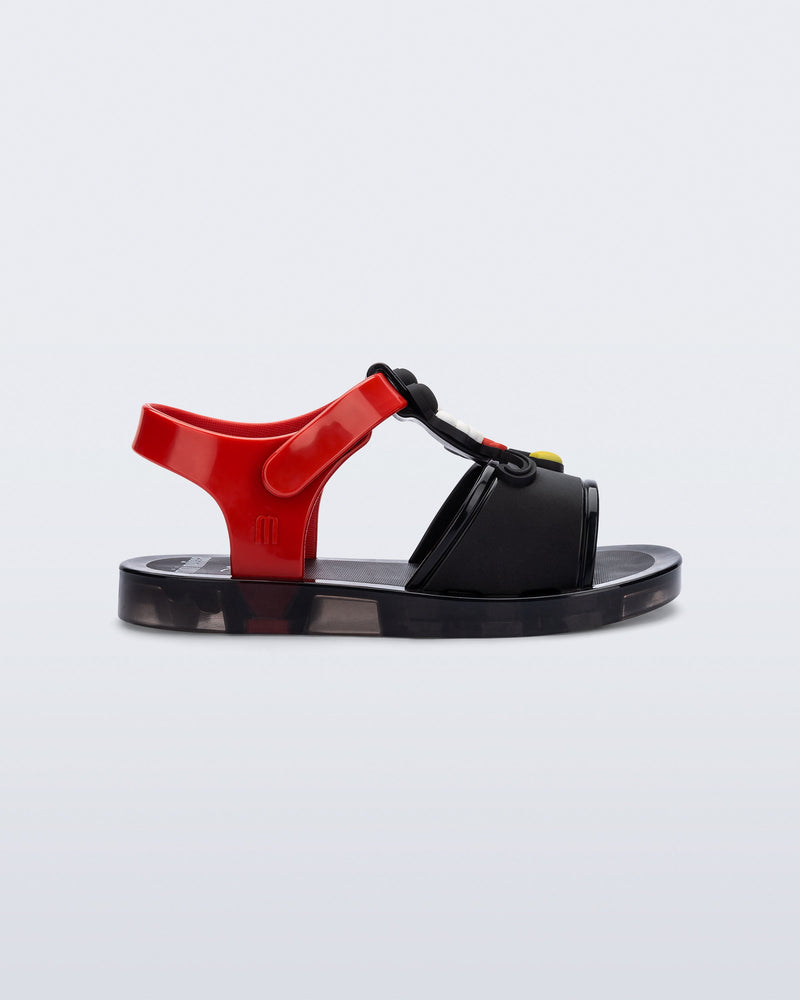 Side view of a black Play Mickey & Minnie sandals with red straps