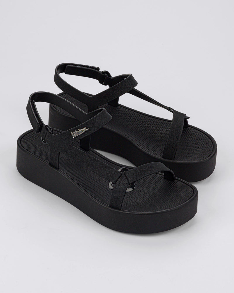Angled view of a pair of black Sun Downtown Platform sandals