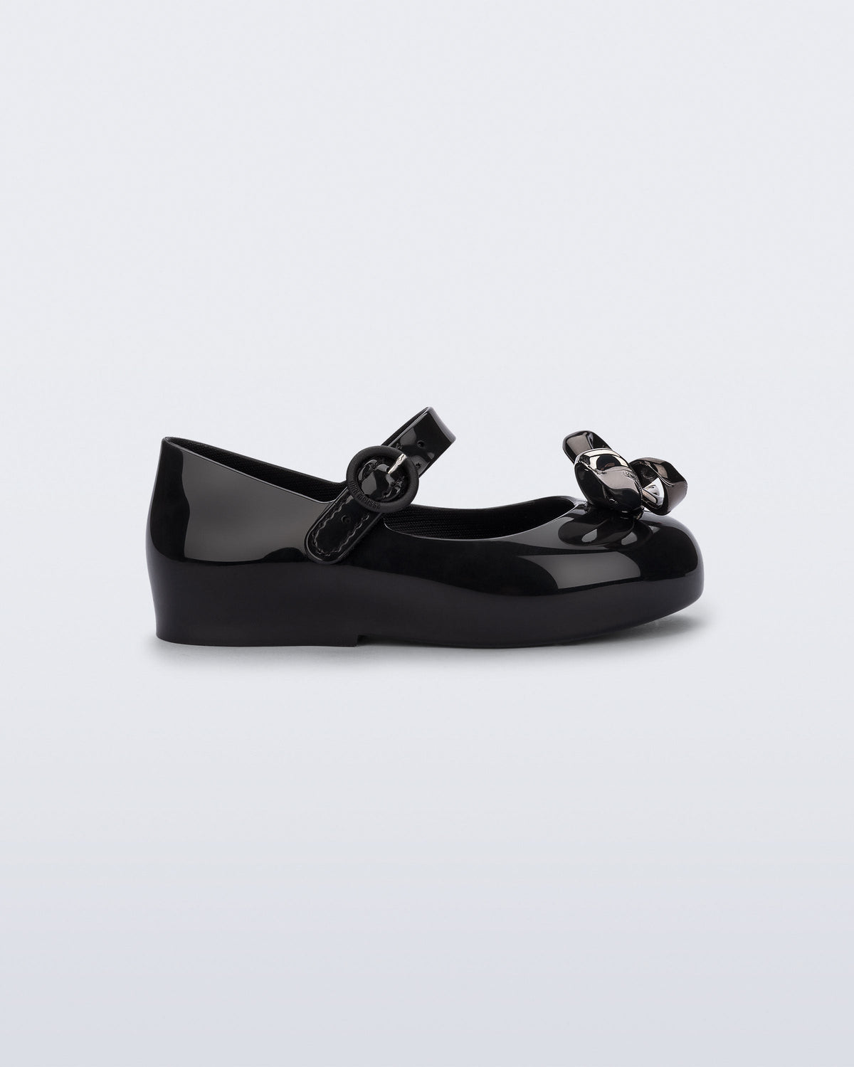 Side view of a black Sweet Love Glam baby ballerina with bow