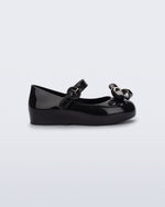 Side view of a black Sweet Love Glam baby ballerina with bow