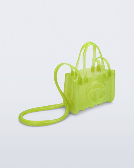 Angled view of the green Small Jelly Shopper x Telfar bag