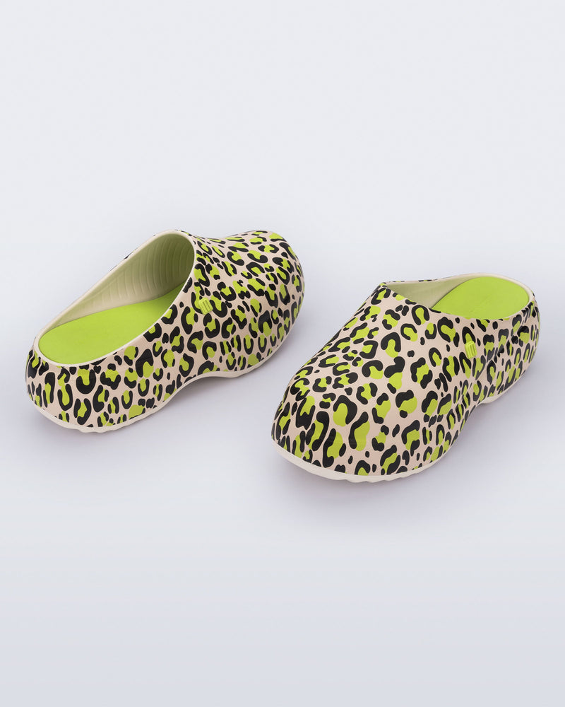 Front and back angled view of a pair of beige/green leopard print Free Clog Print platforms
