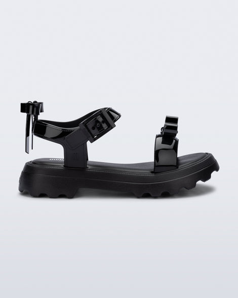 Side view of a black Town Bow sandal
