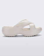 Side view of a beige Free Rise platform slide sandal