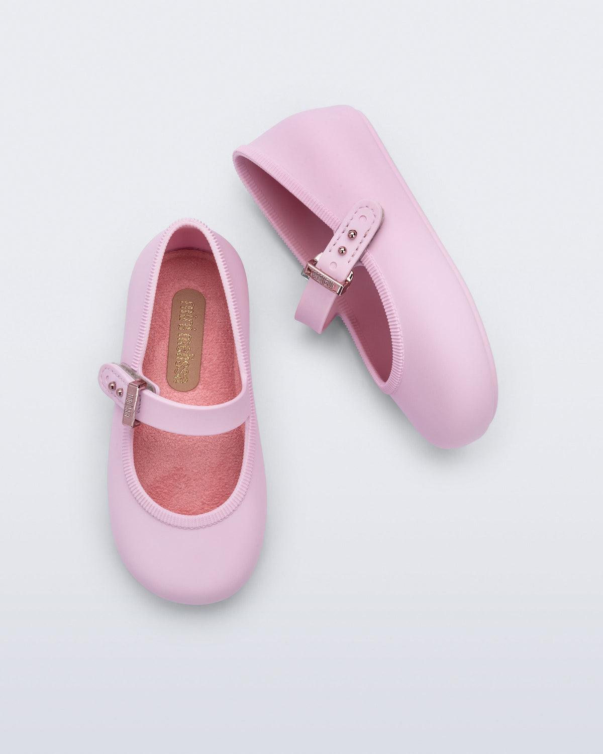 Top and side view of a pair of pink Soft Ballerina baby flat with Velcro strap