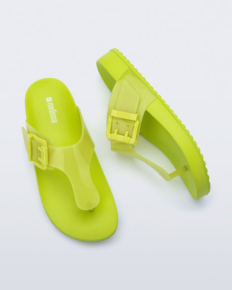 Top and side view of a pair of green Cozy Flip flops