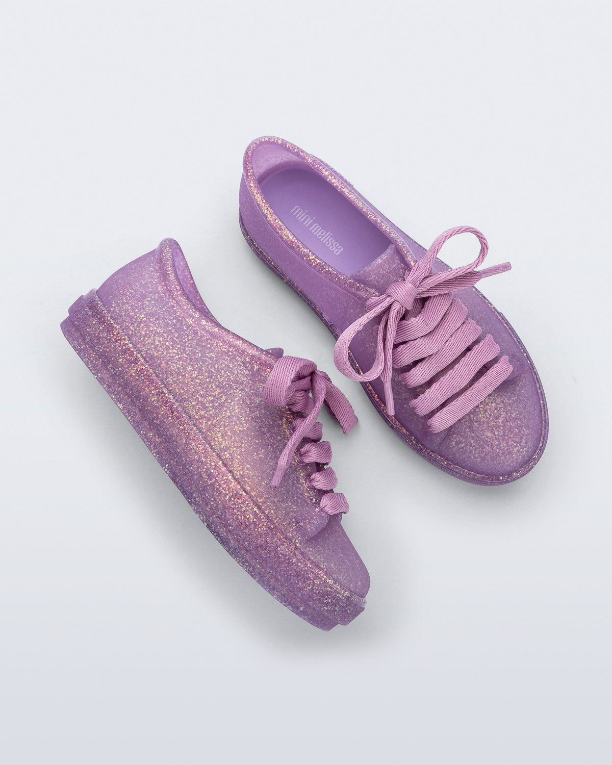 Side and top view of a pair of glitter lilac kids Hip Sneakers lilac laces
