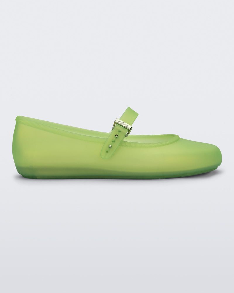 Side view of a green Soft adult flat with strap and green buckle