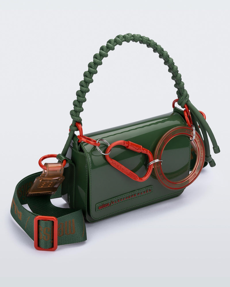 Angled view of an dark green Olga Bag + Alexandre Pavao with short strap fabric long strap