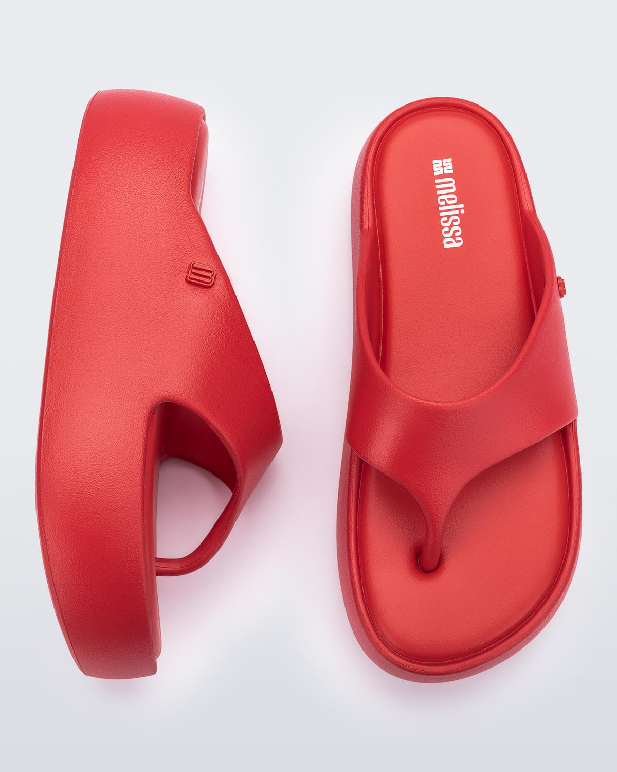 Side and top view of a pair of red Free Platform Thong sandal