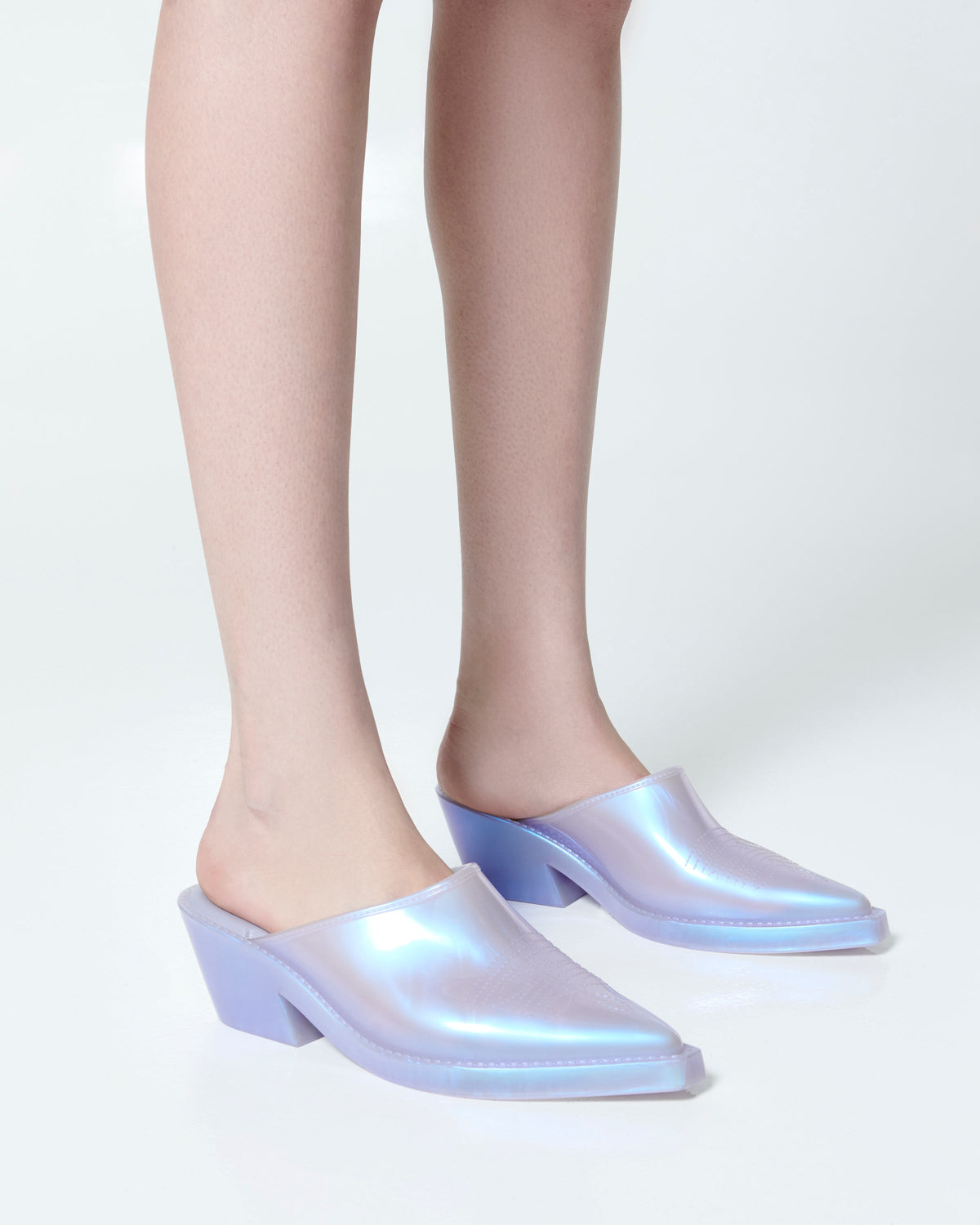 Model's legs wearing a pair of pearly blue Texas Mule heels