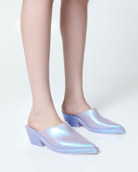 Model's legs wearing a pair of pearly blue Texas Mule heels