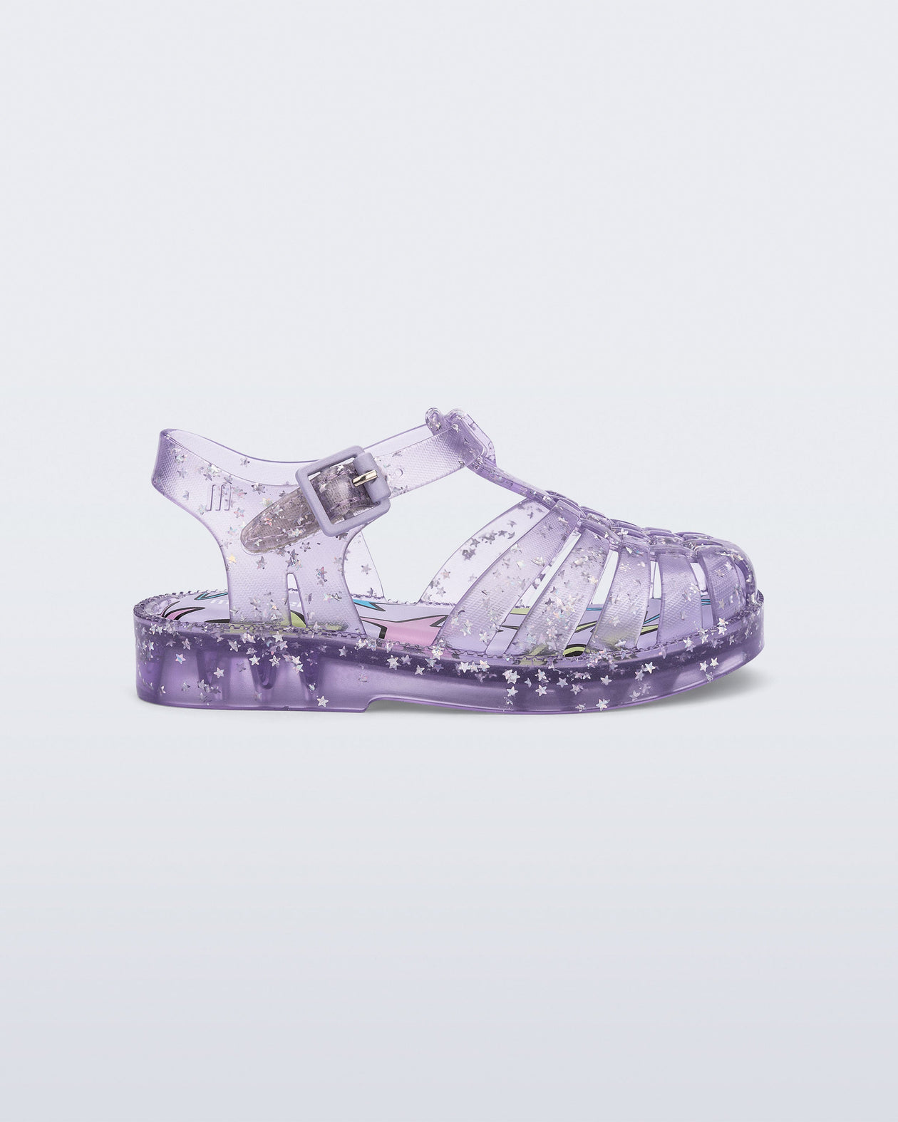 Side view of a clear lilac Possession baby sandal with star glitter