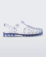 Side view of a clear Possession Crystals sandal