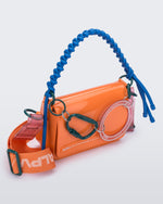 Angled view of an orange Olga Bag + Alexandre Pavao with blue short strap fabric long strap