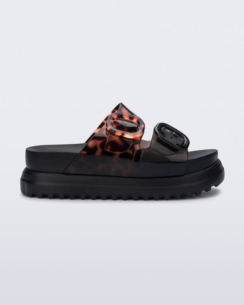 Side view of a black Cozy Platform with Tortoise straps