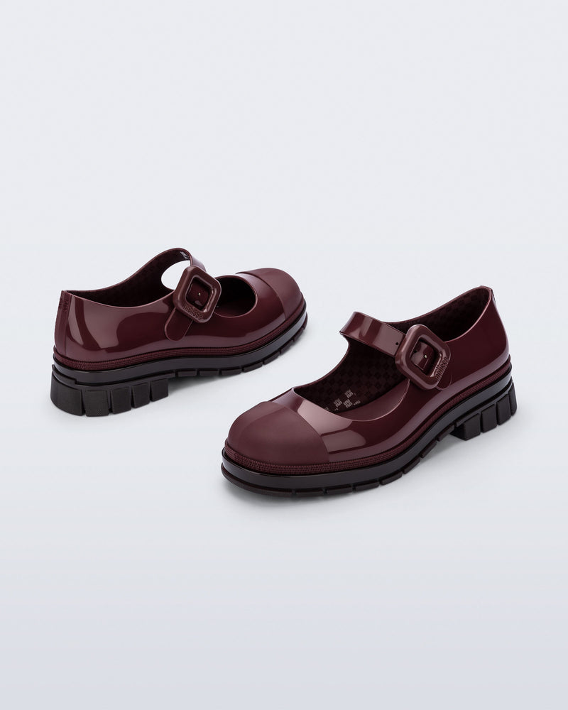 Back and side angle view of a pair of burgundy June mary janes with matte toe cap
