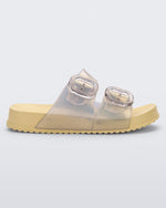 Side view of a pearly yellow Mini Melissa Cozy slide with two front straps with buckle details