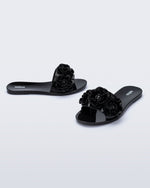 Angled view of a pair of black Babe Springtime slides.