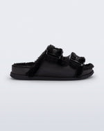 Side view of a black Cozy Warm Slide with black fuzzy insole