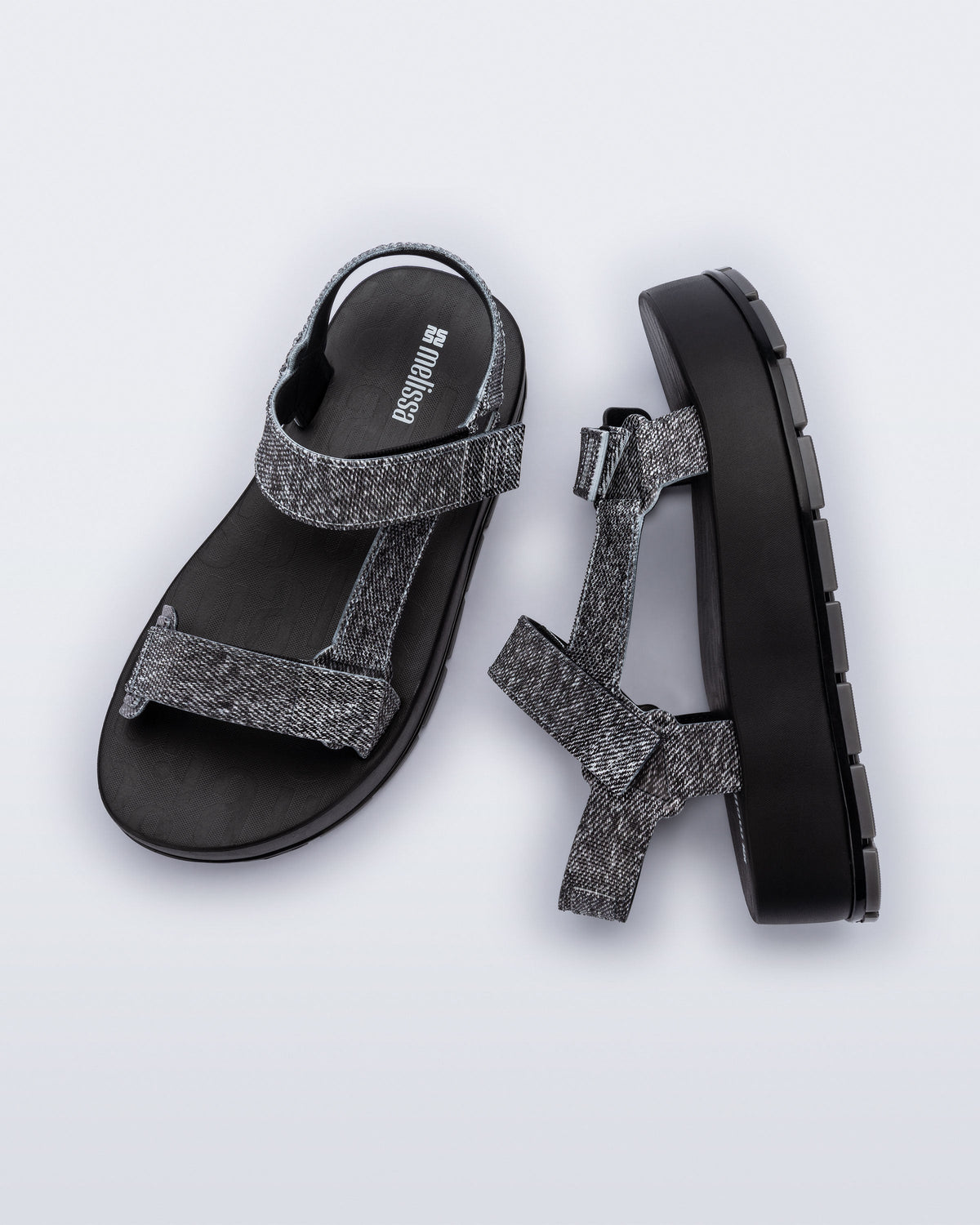 Top and side view of a pair of black jean Flowing Denim platforms
