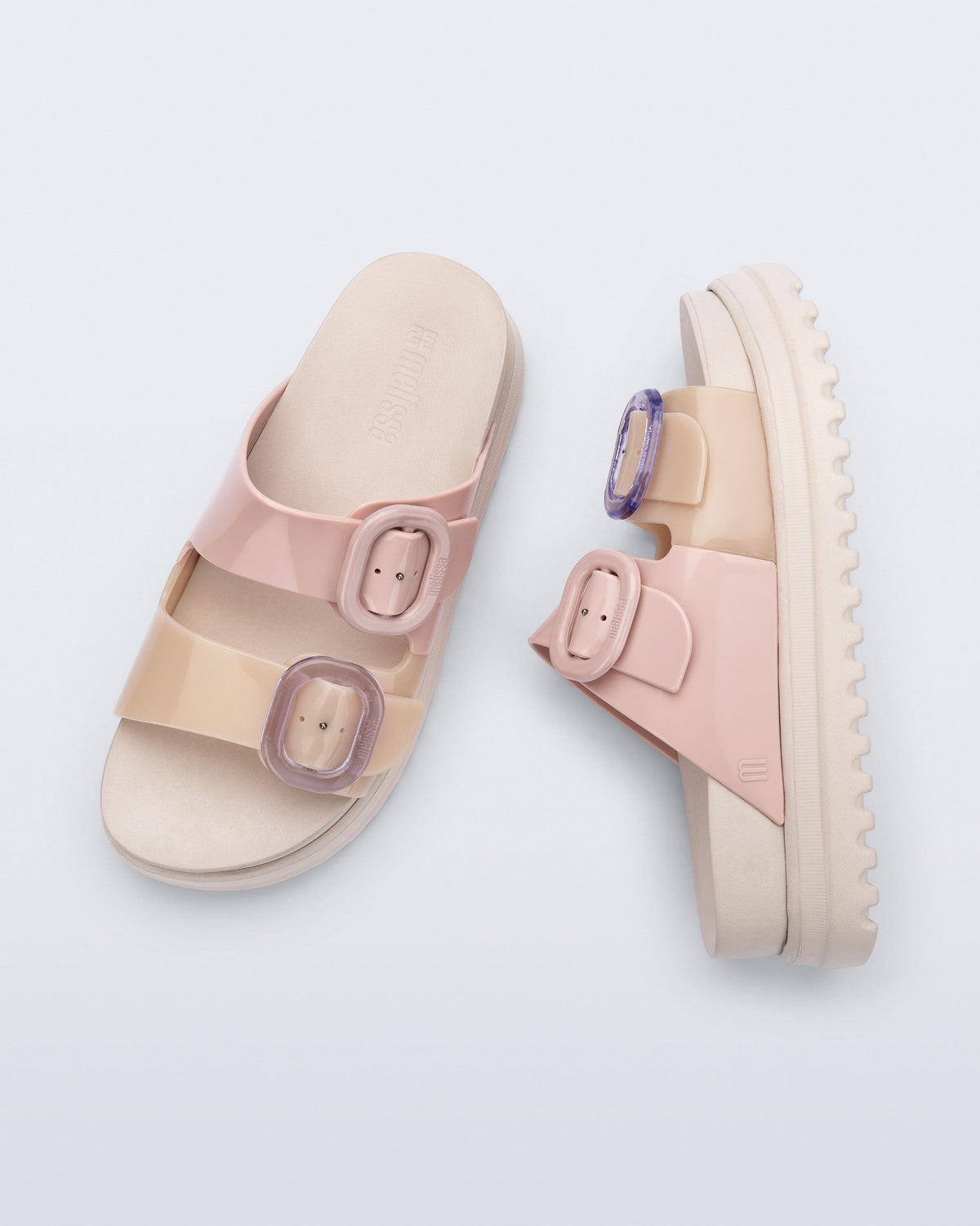 Top and side view of a pair of beige/pink Cozy Platform slide sandals with two buckle straps.