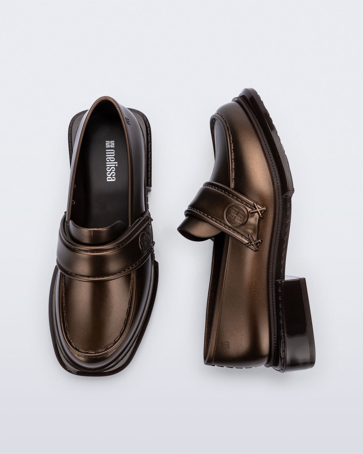 Top and side view of a pair of bronze Spencer loafers