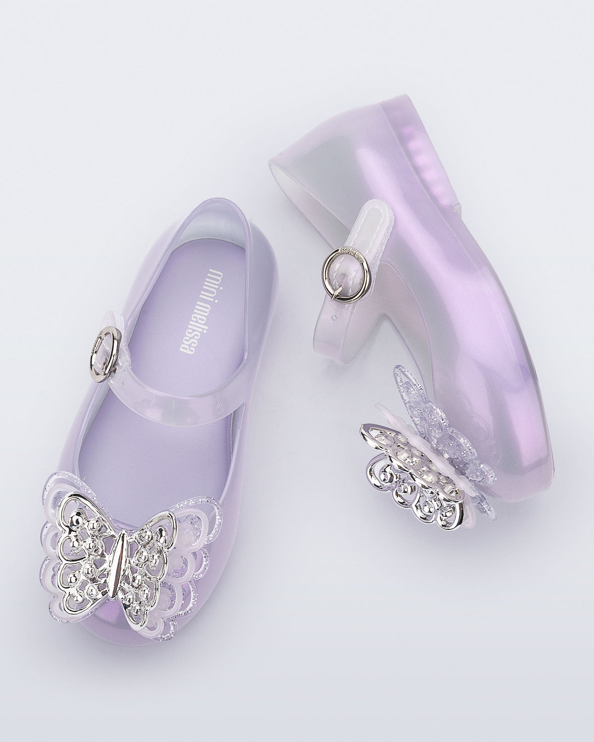 Top and side view of a pair of pearly purple Sweet Love Butterfly baby flats
