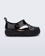 Side view of a black Bowie baby sandal.