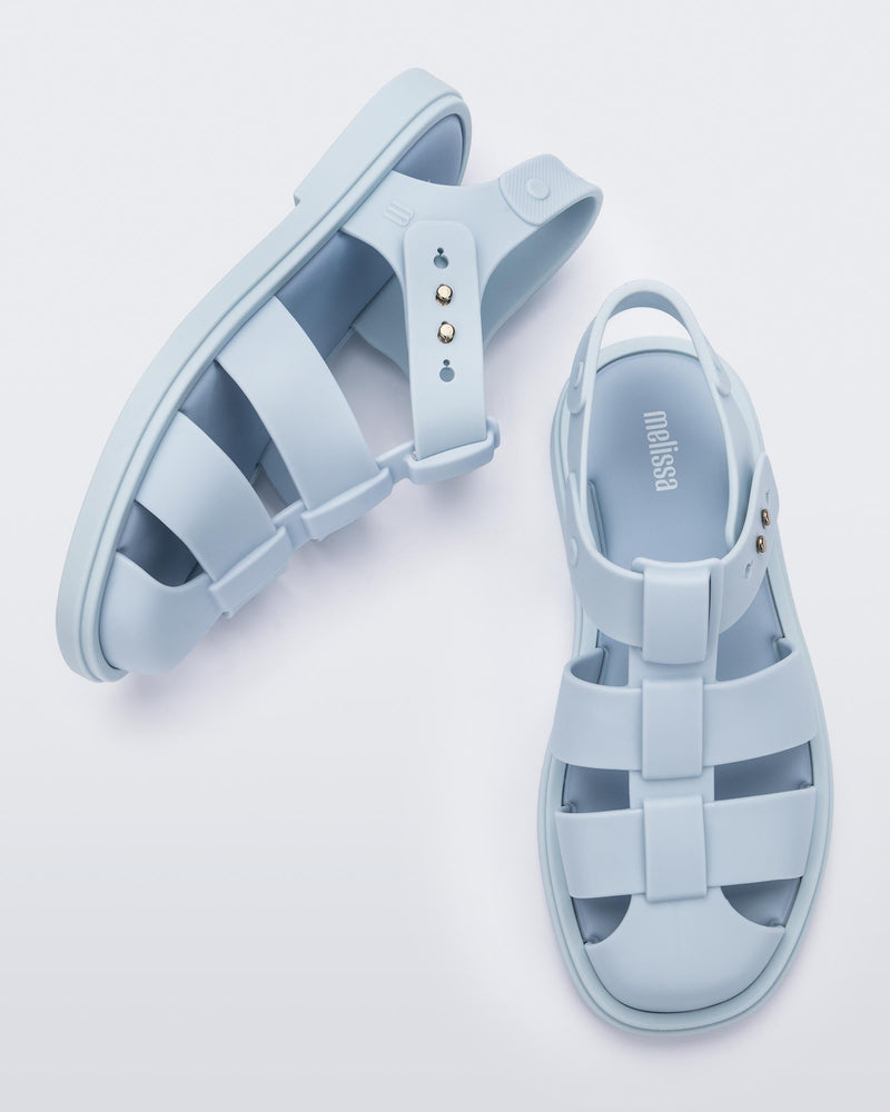 Side and top view of a pair of blue Emma women's sandals.