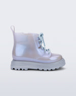 Side view of a pearly blue Coturno baby boot with blue laces.