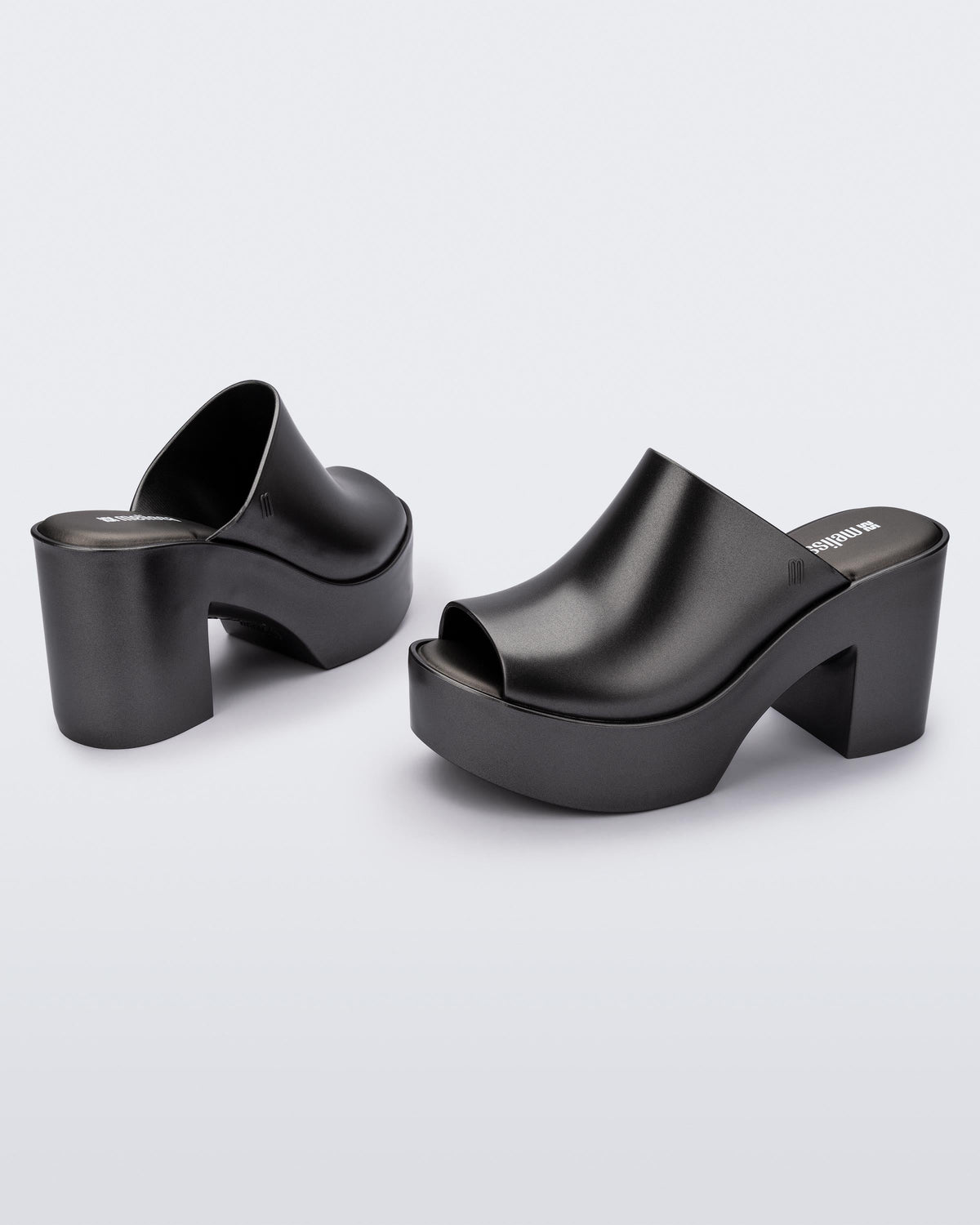Angled view of a pair of dark silver Mule Hype Platforms