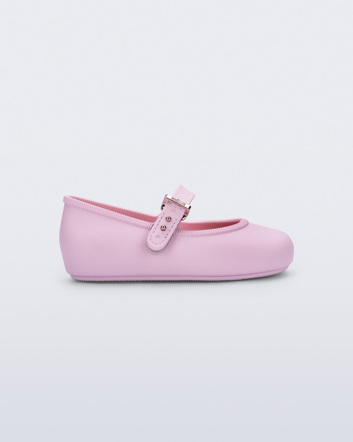 Side view of a pink Soft Ballerina baby flat with Velcro strap