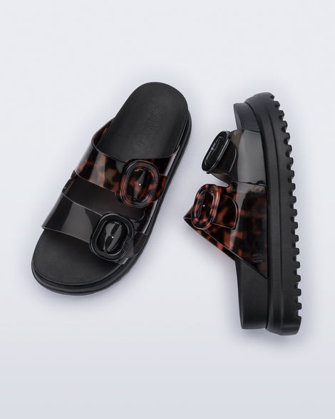 Top and side view of a pair of black Cozy Platform sandals with tortoise color straps