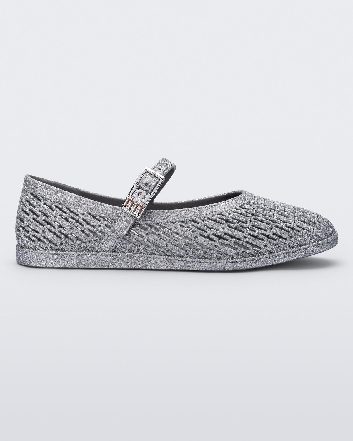 Side view of a silver glitter Harper flat with strap