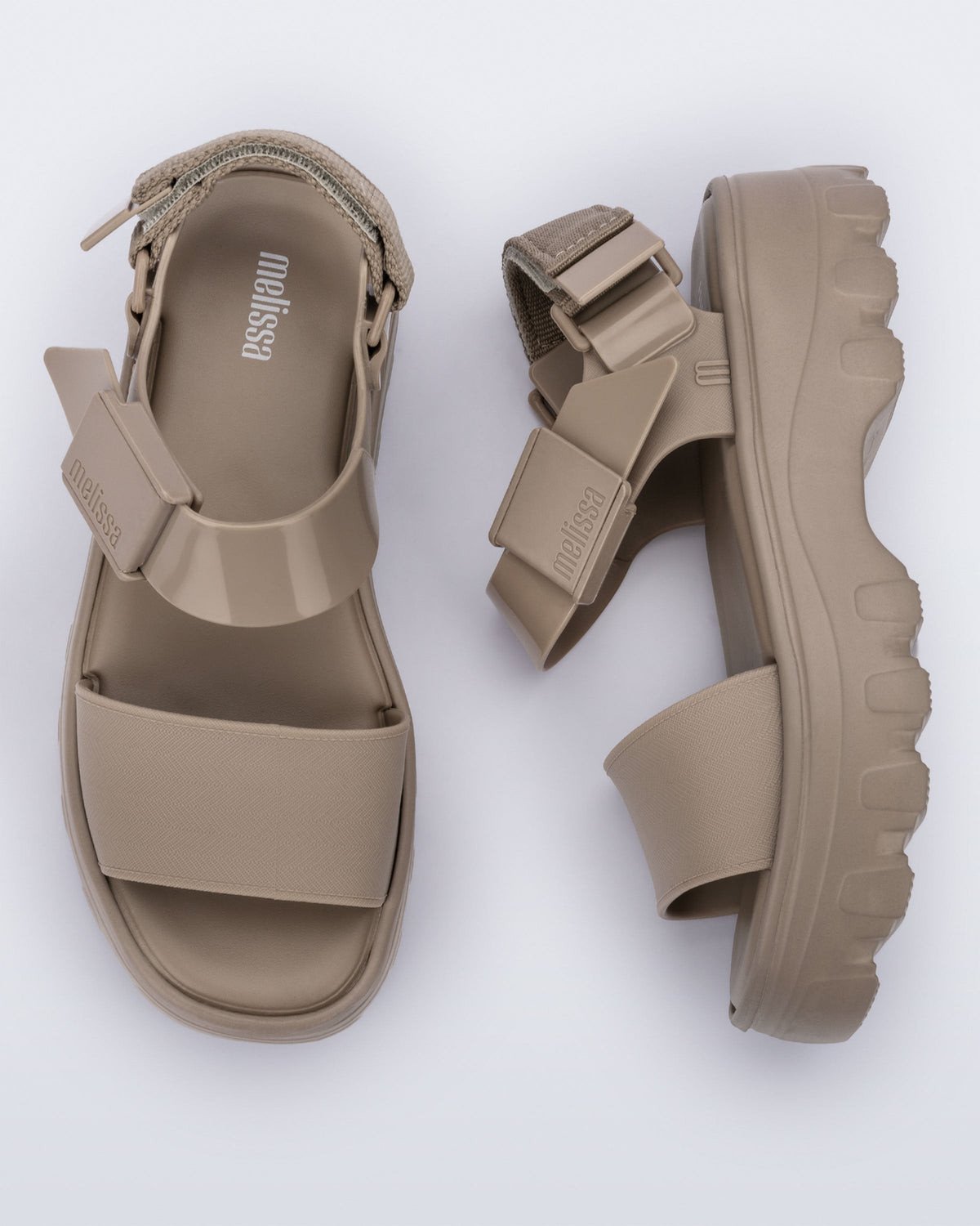 Top and side view of a pair of beige Kick Off platform adult sandals.