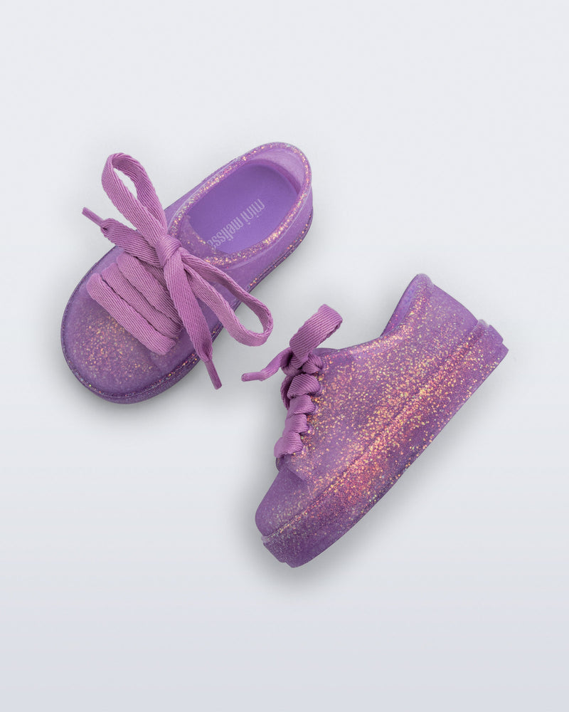 Side and top view of a pair of glitter lilac baby Hip Sneakers lilac laces