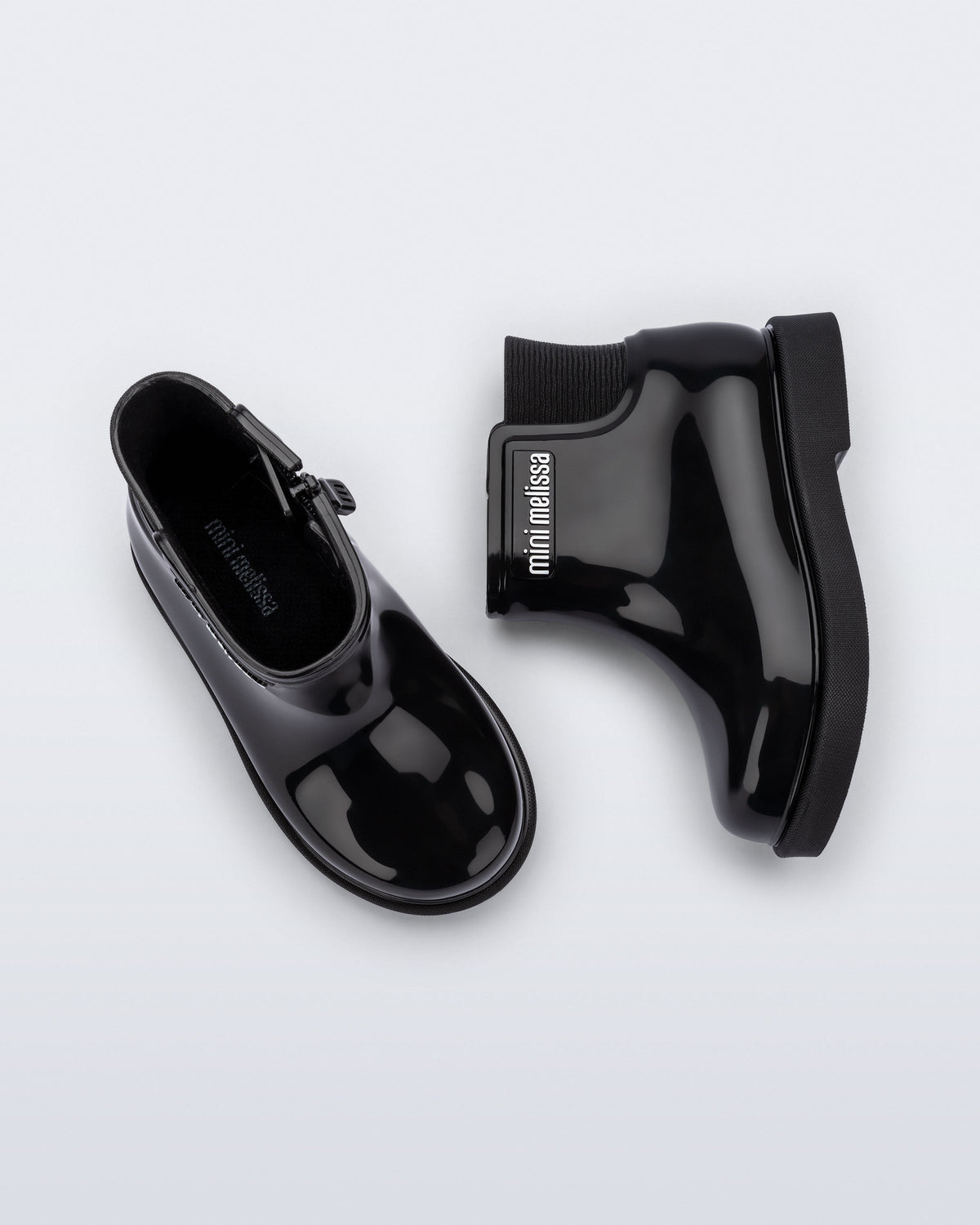 Top and side view of a pair of black Chelsea II baby boots