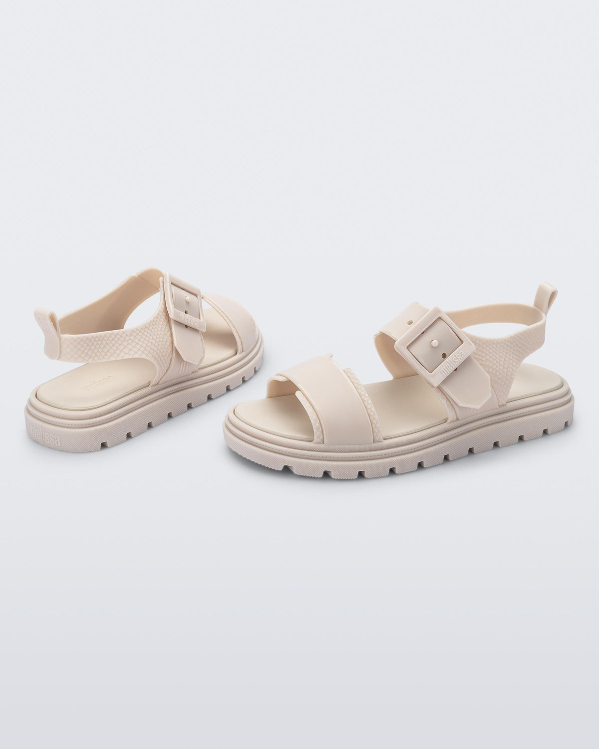 Angled view of a pair of beige Connection Papete sandals