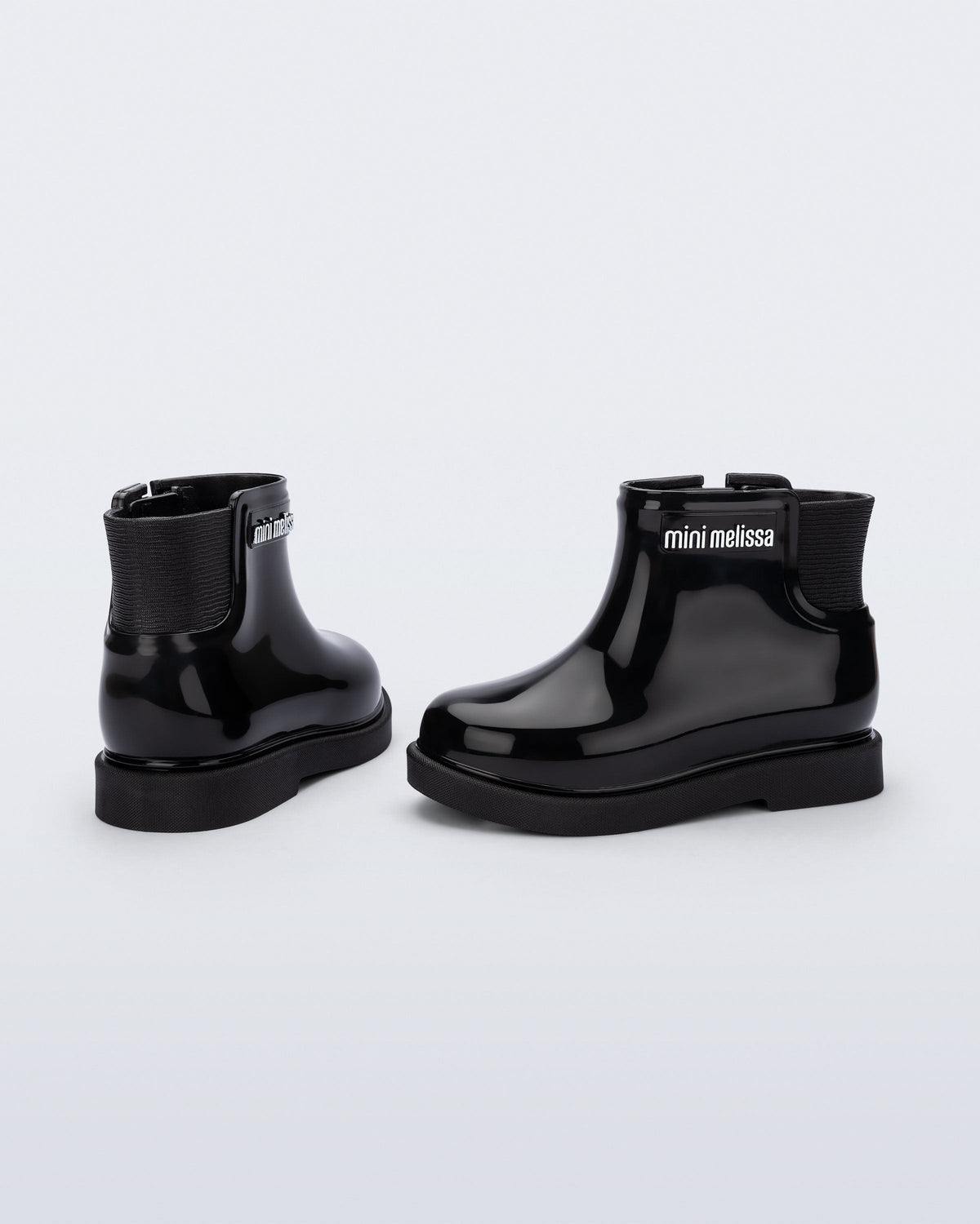 Back and side view of a pair of black Chelsea II baby boots