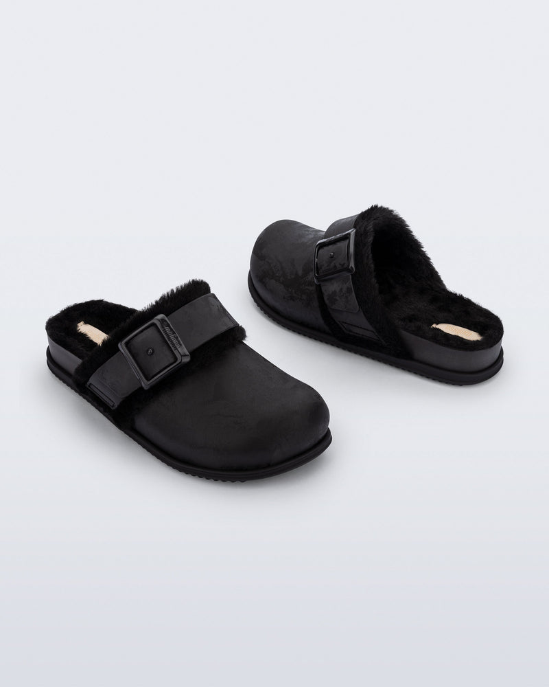 Back and angled view of a pair of black Cozy Warm Clogs with fuzzy insoles